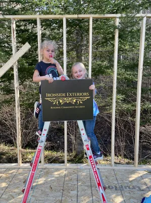 My daughter helping build a storage shed