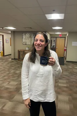 11 oz. Cosmic Speckled Clay Coffee Mugs - This is our fearless leader Nicole enjoying a cup of coffee in our new Hoffs Bakery mugs